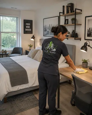 Cleaner refreshing a bedroom and living space